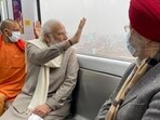 Modi, who was accompanied by CM Yogi Adityanath and Union minister Hardeep Singh Puri, took a little over 10 minutes ride on the metro from the IIT metro station to Geeta Nagar.(Twitter/@narendramodi)