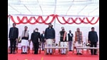 Haryana governor Bandaru Dattatreya, chief minister Manohar Lal Khattar, deputy CM Dushyant Chautala, and newly sworn-in ministers Devender Singh Babli and Kamal Gupta in Chandigarh on Tuesday. (ANI)