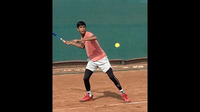 A player in action during the junior tennis tournament on Tuesday. A player in action during the junior tennis tournament on Tuesday.