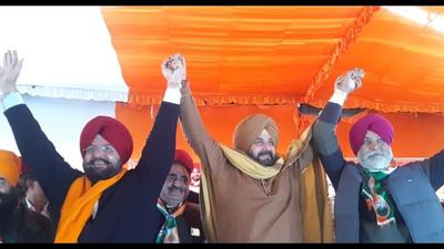 Qadian Congress MLA Fateh Jung Bajwa (left) campaigning with Punjab Congress chief Navjot Singh Sidhu at a rally in his constituency on December 2. Bajwa joined the BJP on Tuesday along with Shri Hargobindpur MLA Balwinder Singh Laddi. (HT file photo) Qadian Congress MLA Fateh Jung Bajwa (left) campaigning with Punjab Congress chief Navjot Singh Sidhu at a rally in his constituency on December 2. Bajwa joined the BJP on Tuesday along with Shri Hargobindpur MLA Balwinder Singh Laddi. (HT file photo)