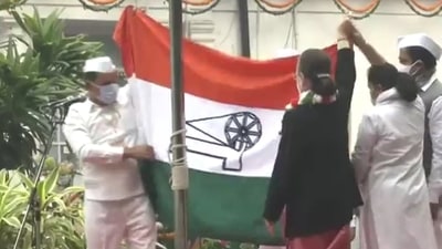 Congress president Sonia Gandhi unfurls the flag at AICC headquarters on Tuesday. (ANI Photo) Congress president Sonia Gandhi unfurls the flag at AICC headquarters on Tuesday. (ANI Photo)