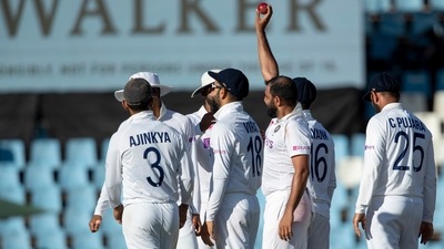 Mohammed Shami holds the ball as he celebrates with teammates after taking a career 200th Test wickets (AP) Mohammed Shami holds the ball as he celebrates with teammates after taking a career 200th Test wickets (AP)