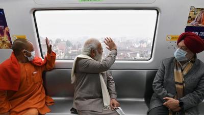 Prime Minister Narendra Modi traveling in Kanpur Metro, in Kanpur on Tuesday. (ANI Photo)