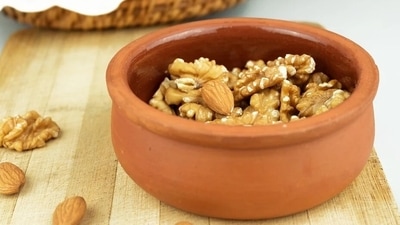 Almonds and walnuts: Nuts like walnuts and almonds are a perfect snack for winters to take care of those mid-meal cravings. While a handful of nuts can do the trick at any time of the year, they make a lovely roasted snack in the winter. "I remember as a kid, my mother always increased my intake of these wonder nuts to keep me warm," shares Kapur. (Pixabay) Almonds and walnuts: Nuts like walnuts and almonds are a perfect snack for winters to take care of those mid-meal cravings. While a handful of nuts can do the trick at any time of the year, they make a lovely roasted snack in the winter. "I remember as a kid, my mother always increased my intake of these wonder nuts to keep me warm," shares Kapur. (Pixabay)