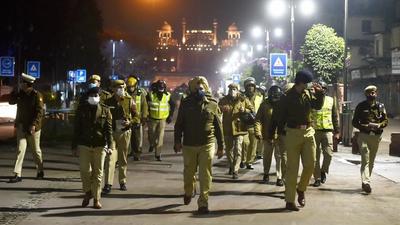 Policemen patrol during a Covid-induced night curfew at Chandni Chowk in New Delhi on Monday. (PTI) Policemen patrol during a Covid-induced night curfew at Chandni Chowk in New Delhi on Monday. (PTI)