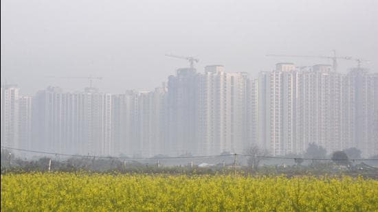 A view of skyscrapers blanketed in smog amid rising air pollution in Greater Noida, India on Monday. (HT photo)