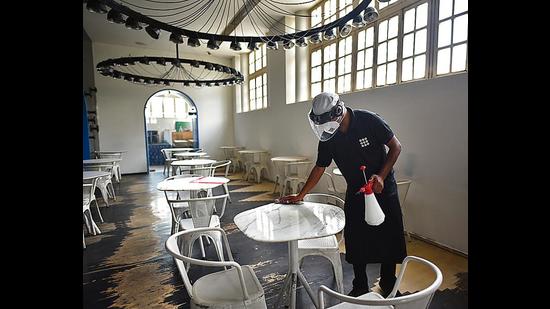Restaurants are functioning at 50% capacity, to follow Covid protocols, and even ensuring regular sanitisation and social distancing. (Photo:Sanchit Khanna/HT)