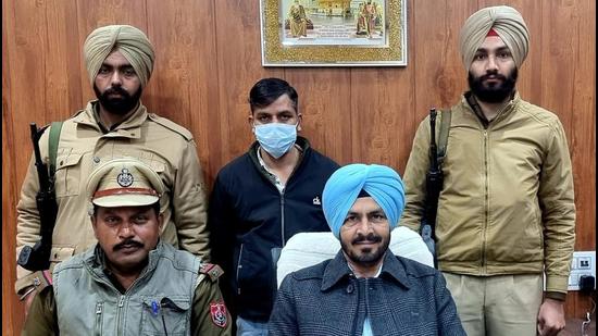 The drug peddler in the Ludhiana STF custody on Tuesday. (HT Photo)