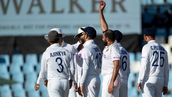 Mohammed Shami holds the ball as he celebrates with teammates after taking a career 200th Test wickets(AP)