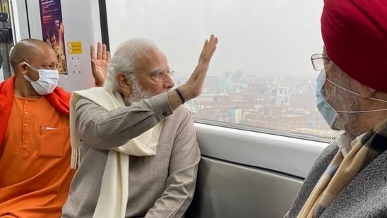 Modi, who was accompanied by CM Yogi Adityanath and Union minister Hardeep Singh Puri, took a little over 10 minutes ride on the metro from the IIT metro station to Geeta Nagar.(Twitter/@narendramodi) Modi, who was accompanied by CM Yogi Adityanath and Union minister Hardeep Singh Puri, took a little over 10 minutes ride on the metro from the IIT metro station to Geeta Nagar.(Twitter/@narendramodi)