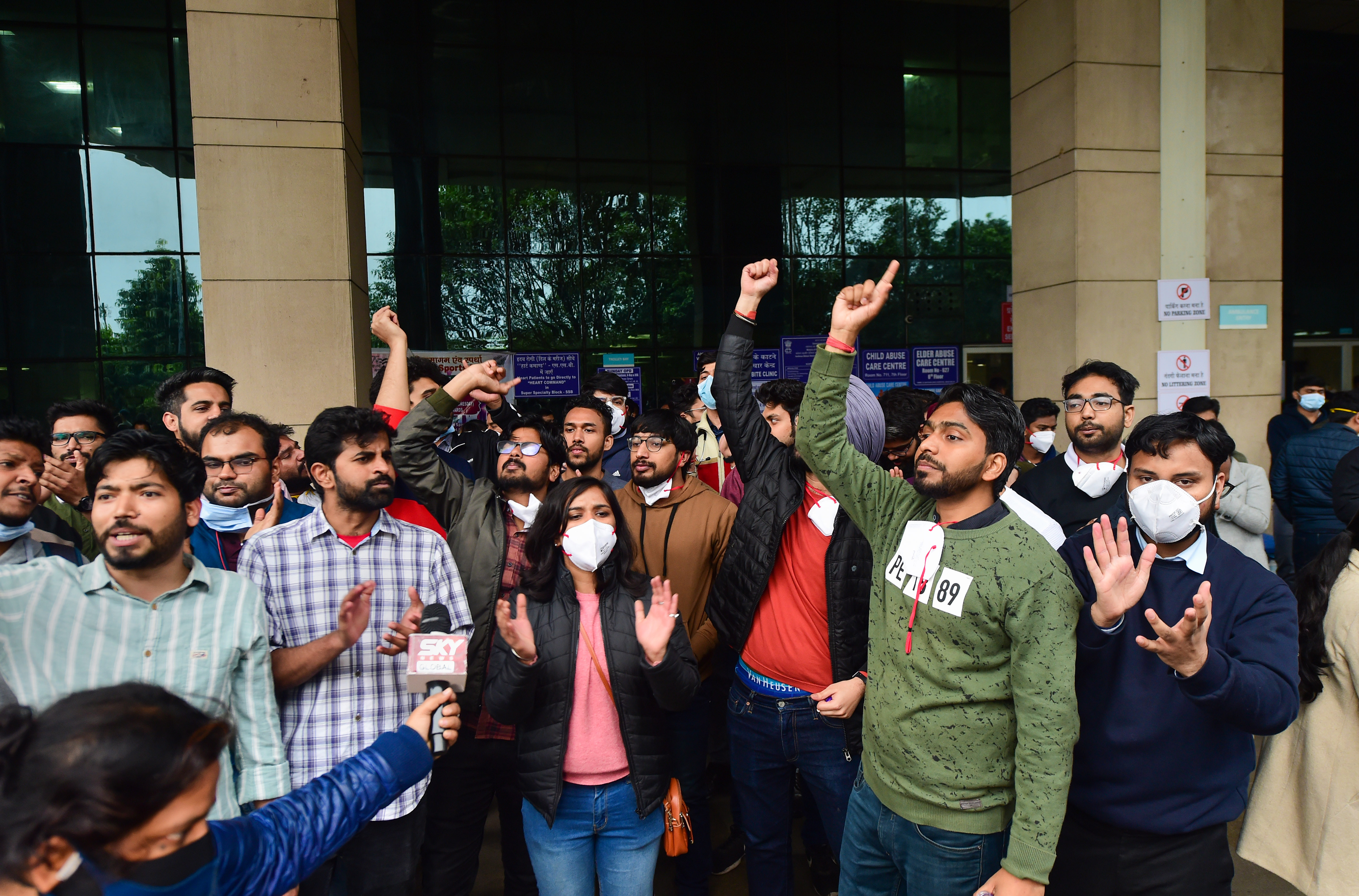 Doctors raise slogans during their protest over the delay in NEET-PG 2021 counselling, at the Safdarjung hospital in New Delhi, Tuesday. (PTI) Doctors raise slogans during their protest over the delay in NEET-PG 2021 counselling, at the Safdarjung hospital in New Delhi, Tuesday. (PTI)