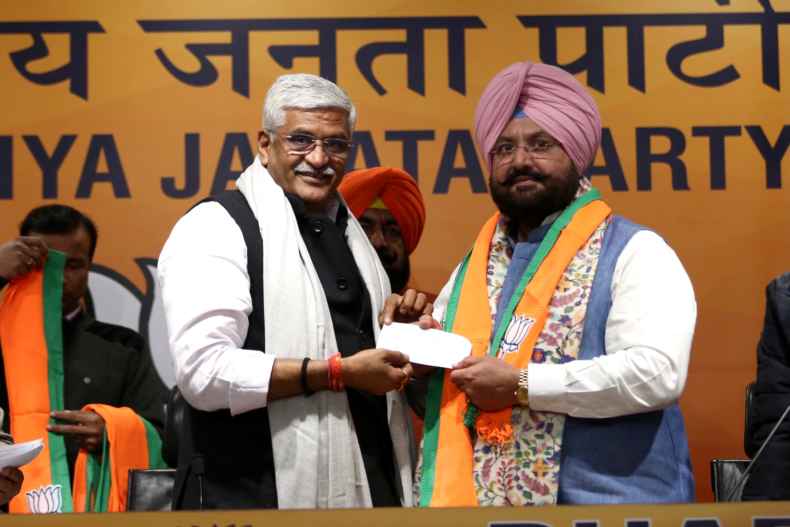 Union minister and BJP’s Punjab poll incharge Gajendra Singh Shekhawat welcoming Qadian MLA Fateh Jang Singh Bajwa into the party fold on December 28, 2021.&nbsp; (ANI Photo)