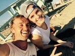 Tom Felton and Emma Watson pose together.