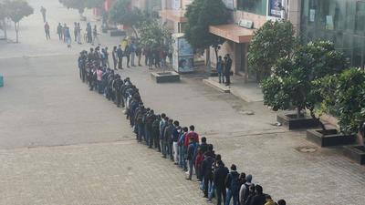 Passengers lined up outside the Akshardham Metro Station in New Delhi on Wednesday. (PTI) Passengers lined up outside the Akshardham Metro Station in New Delhi on Wednesday. (PTI)