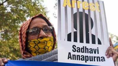 A demonstrator holds a placard during a protest over the Haridwar hate speech episode, in New Delhi earlier this week. (ANI)