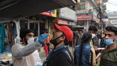 A health worker collects a swab sample for Covid-19 test, at Patel Nagar, on Tuesday. (Sanchit Khanna/HT) A health worker collects a swab sample for Covid-19 test, at Patel Nagar, on Tuesday. (Sanchit Khanna/HT)