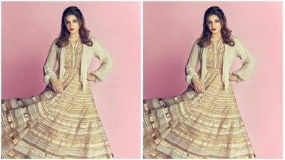Raveena played muse to fashion designer Tarun Tahiliani and picked an ivory white and golden gown from his wardrobe. (Instagram/@officialraveenatandon)