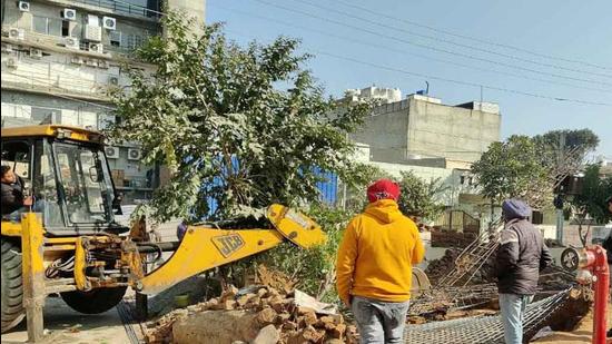 MC officials taking down an illegal under-construction commercial building in the residential area of Sarabha Nagar block- B in on December 29, 2021. (HT Photo)