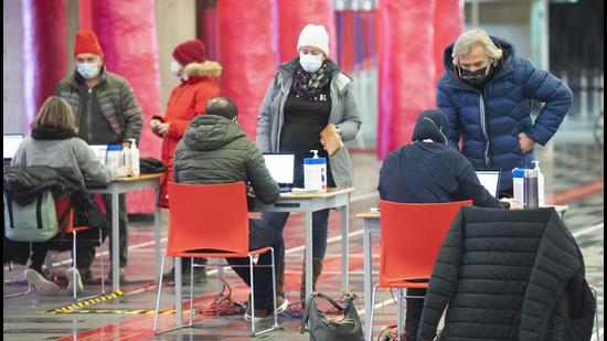 People register to receive a Covid-19 vaccination in Montreal, as the pandemic continues in Canada and around the world. (AP)