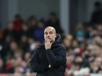 Manchester City's head coach Pep Guardiola watches during the English Premier League soccer match between Brentford and Manchester City at the Brentford Community Stadium in London, Wednesday.(AP) Manchester City's head coach Pep Guardiola watches during the English Premier League soccer match between Brentford and Manchester City at the Brentford Community Stadium in London, Wednesday.(AP)