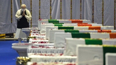 Prime Minister Narendra Modi pays homage to CDS General Bipin Rawat and others at Palaim airport, in New Delhi, on December 9. India's first Chief of Defence Staff (CDS) General Bipin Rawat, his wife Madhulika Raje Singh Rawat, and 11 others were killed in an Indian Air Force (IAF) chopper crash near Coonoor in Tamil Nadu. (Sanjeev Verma / HT Photo)