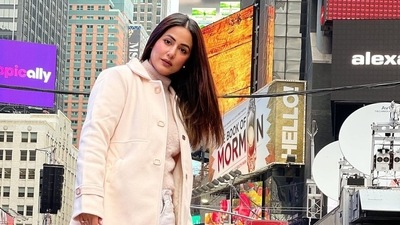 Hina wore a beige coat over a matching turtleneck and white pants. Hina wore a beige coat over a matching turtleneck and white pants.