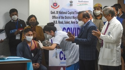 Manish Kumar, a sanitation worker at Delhi’s All India Institute of Medical Sciences, was administered the first Covid-19 vaccine dose on January 16 as the nationwide inoculation programme kicked off. Since then, over 1.4 billion doses have been administered across the country, and more than 596 million people have been fully protected against the coronavirus. (Amal KS / HT Photo) Manish Kumar, a sanitation worker at Delhi’s All India Institute of Medical Sciences, was administered the first Covid-19 vaccine dose on January 16 as the nationwide inoculation programme kicked off. Since then, over 1.4 billion doses have been administered across the country, and more than 596 million people have been fully protected against the coronavirus. (Amal KS / HT Photo)
