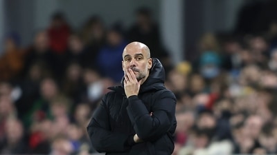 Manchester City's head coach Pep Guardiola watches during the English Premier League soccer match between Brentford and Manchester City at the Brentford Community Stadium in London, Wednesday. (AP) Manchester City's head coach Pep Guardiola watches during the English Premier League soccer match between Brentford and Manchester City at the Brentford Community Stadium in London, Wednesday. (AP)