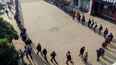 People wait in a long queue to enter the Akshardham Metro Station as Covid-19 screening has been enhanced in New Delhi. (PTI) People wait in a long queue to enter the Akshardham Metro Station as Covid-19 screening has been enhanced in New Delhi. (PTI)