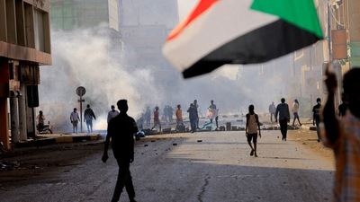 People march to the presidential palace, protesting against military rule following last month's coup in Khartoum, Sudan.