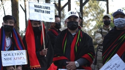 Nagas hold placards at a rally protesting the killings of 14 civilians this month in Nagaland. (Representative image/AP File) Nagas hold placards at a rally protesting the killings of 14 civilians this month in Nagaland. (Representative image/AP File)