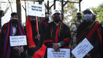 Nagas hold placards at a rally protesting the killings of 14 civilians this month in Nagaland. (Representative image/AP File) Nagas hold placards at a rally protesting the killings of 14 civilians this month in Nagaland. (Representative image/AP File)