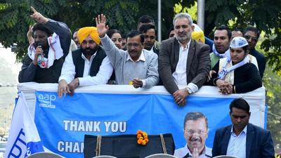 AAP convener Arvind Kejriwal with party’s Punjab unit chief Bhagwant Mann, senior leader Pardeep Chabra and others during the victory procession in Chandigarh on Thursday. (Ravi Kumar/HT) AAP convener Arvind Kejriwal with party’s Punjab unit chief Bhagwant Mann, senior leader Pardeep Chabra and others during the victory procession in Chandigarh on Thursday. (Ravi Kumar/HT)