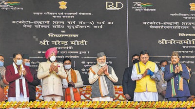 Prime Minister Narendra Modi with Uttarakhand Chief Minister Pushkar Singh Dhami and other dignitaries in Haldwani, Uttarakhand, on Thursday. (PTI)