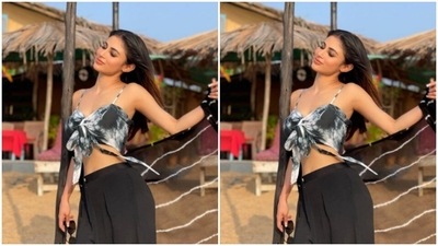 Styled by fashion stylist Anuradha Khurana, Mouni left her long straight tresses open with a middle part. (Instagram/@imouniroy)