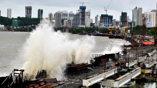Sea waves crash onto the site of the coastal road project during high tide at Marine Drive, in Mumbai, on June 10. The coastal road project measuring around 10km between the Princess Street flyover and Worli-end of Bandra-Worli sea link is expected to be ready by July 2023.(Anshuman Poyrekar / HT Photo)
