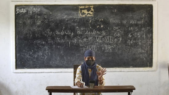 A teacher conducts an online class inside an empty classroom, in Sector 45, Noida, on July 6. Schools across the country remained closed for most of the year due to the Covid-19 pandemic.(Sunil Ghosh / HT Photo)