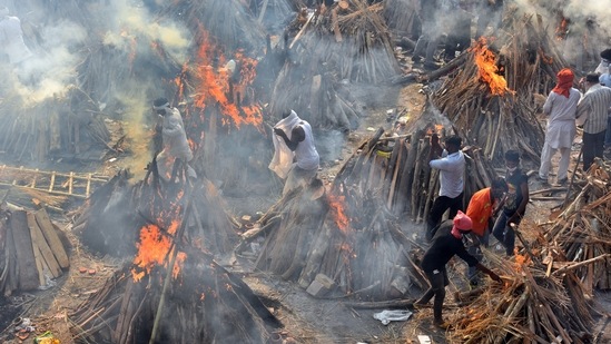 Funeral pyres of people who died of Covid-19 at the Ghazipur crematorium in New Delhi, on April 26. India’s deadly second wave of the coronavirus not only created shortages of oxygen, medicines and hospital beds, but also of wood for funeral pyres, hearses and crematorium slots, forcing people to pay exorbitant amounts to perform the last rites of loved ones.(Raj K Raj / HT Photo)