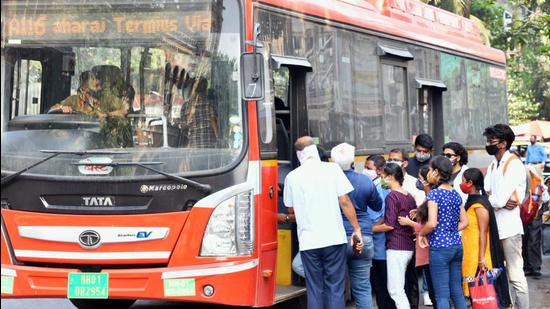 A conductor checks Covid-19 vaccine certificate before giving a bus ticket to passengers, in Mumbai. (ANI)