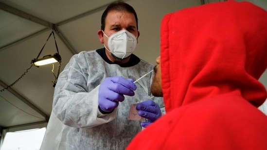 A healthcare professional uses a nasal swab to test a person for the coronavirus disease (Covid-19) in Indiana, US, on Wednesday.(Reuters Photo)