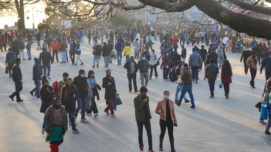 Tourists on the Ridge ahead of New Year 2022 celebrations, amid concern over rising Omicron cases, in Shimla.(PTI)