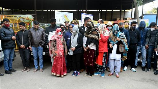 The suspects in front of Sector 58 police station on Thursday. (Sunil Ghosh/HT photo)