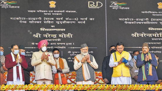 Prime Minister Narendra Modi with Uttarakhand Chief Minister Pushkar Singh Dhami and other dignitaries in Haldwani, Uttarakhand, on Thursday. (PTI)