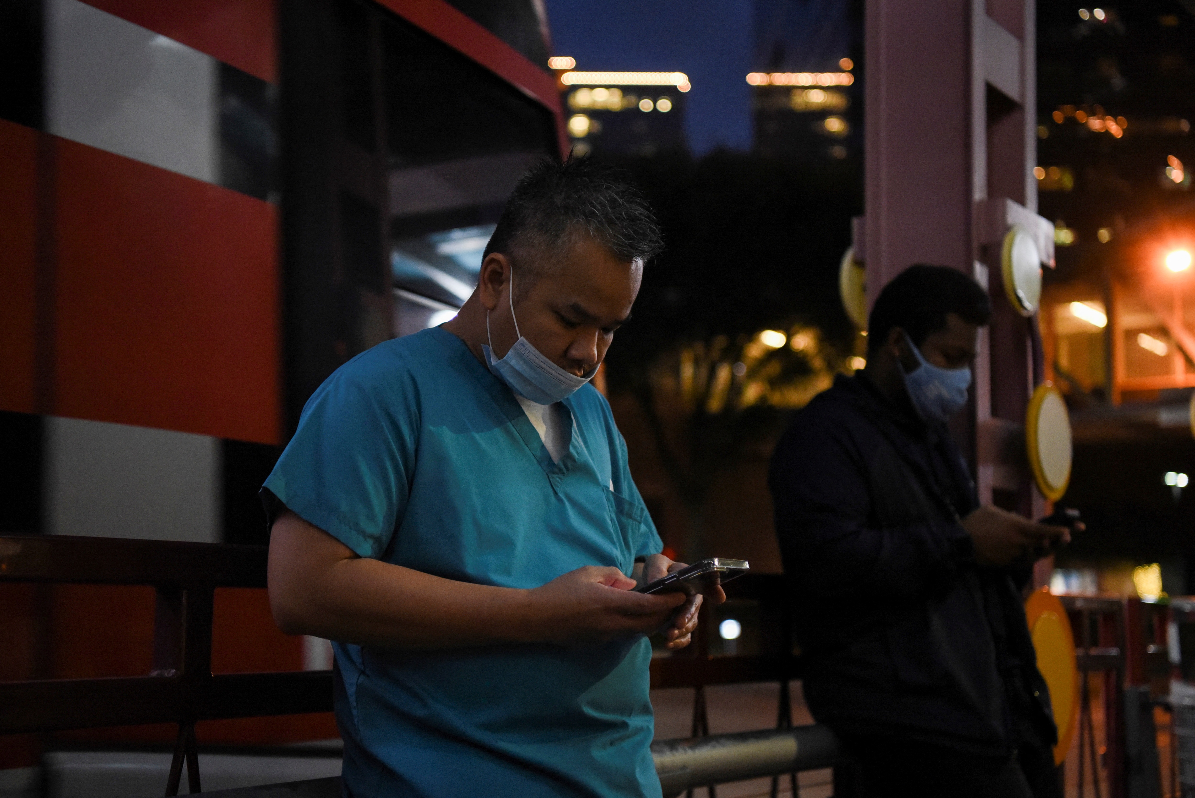 Healthcare workers prepare to leave following a shift change as the Omicron variant of the coronavirus continues to spread through the country in Houston, Texas. (REUTERS)