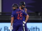 India's KL Rahul and Rohit Sharma rest in between overs during the Cricket Twenty20 World Cup match between India and Namibia in Dubai, UAE.