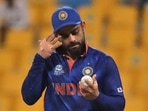 India's captain Virat Kohli holds the ball before handing it over to the next bowler during the Cricket Twenty20 World Cup match between India and Afghanistan in Abu Dhabi, UAE.