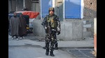 Paramilitary soldier stands guard near the site of the gunfight on the outskirts of Srinagar, Jammu and Kashmir. (Waseem Andrabi/HT) Paramilitary soldier stands guard near the site of the gunfight on the outskirts of Srinagar, Jammu and Kashmir. (Waseem Andrabi/HT)