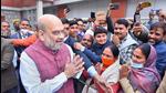 Union home minister Amit Shah greeting BJP workers in Lucknow. (PTI) Union home minister Amit Shah greeting BJP workers in Lucknow. (PTI)
