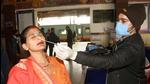 A medic collects sample for Covid testing, at Patna Junction on Friday. (Santosh Kumar/HT Photo) A medic collects sample for Covid testing, at Patna Junction on Friday. (Santosh Kumar/HT Photo)