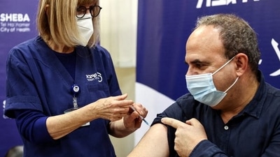 A man receives a fourth dose of coronavirus disease (Covid-19) vaccine as part of a trial in Israel.&nbsp; (REUTERS)